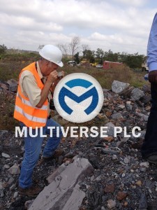 Inspection of lead/zinc ore sample by geologist/mining engineer from Canada at Abuni site, Nasarawa State-Nigeria. IMG_0741_1